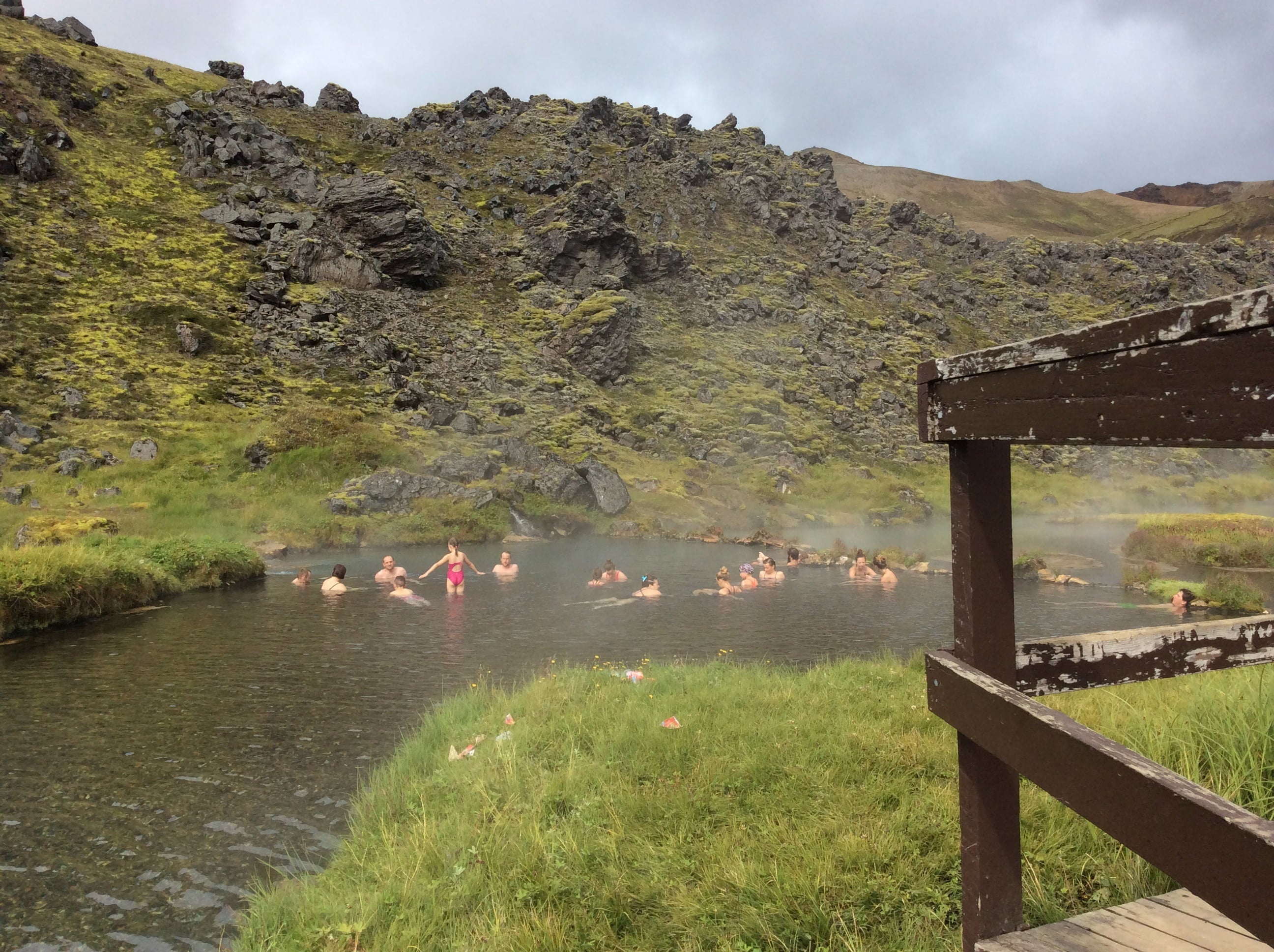 Landmannalaugar visitors enjoying a hot spring bath during summer in Iceland.