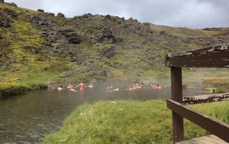 Landmannalaugar visitors enjoying a hot spring bath during summer in Iceland.