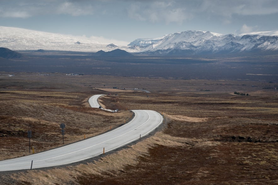 The road winds its way through Thingvellir National Park, Iceland