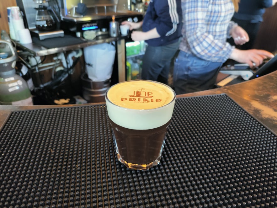 Coffee at Prikið café in Reykjavik with the iconic Prikið logo printed on the foam using a coffee printer