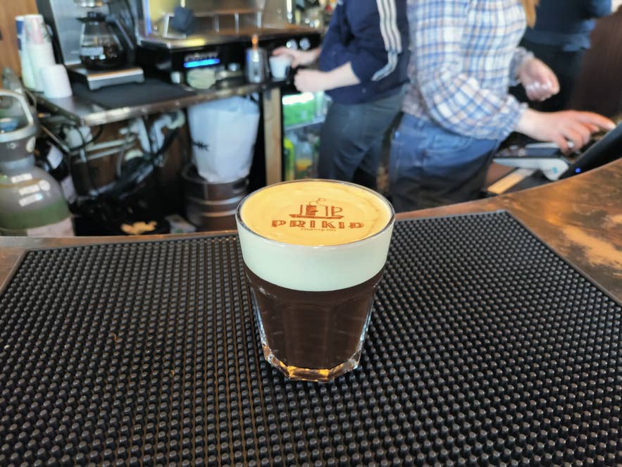 Coffee at Prikid Cafe in Reykjavik with logo printed in foam using a coffee printer.