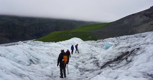 Glacier hikers enjoy the wonders of an ice cap in Iceland.