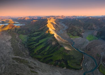 Landmannalaugar is the starting point of the Laugavegur trail where you'll see colorful rhyolite mountains and bubbling geothermal springs.