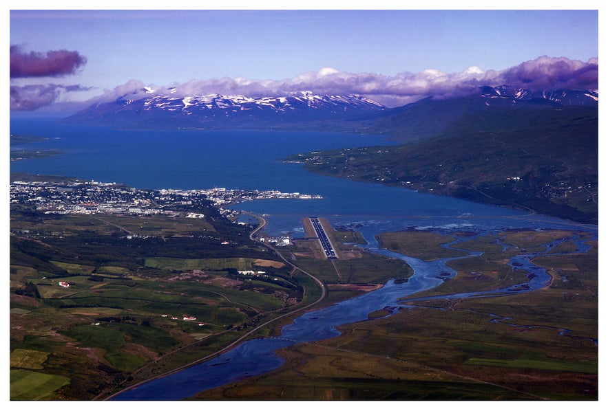 Bird's-eye view of Akureyri Airport where the single runway and beautiful landscapes can be seen.