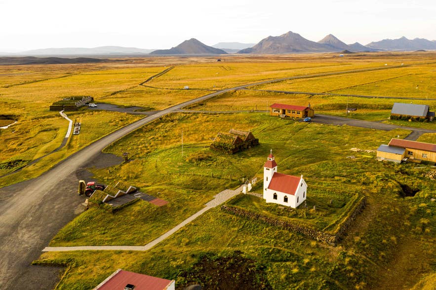 Turf roofed timber houses and a church at Modrudalur farm in Northeast Iceland