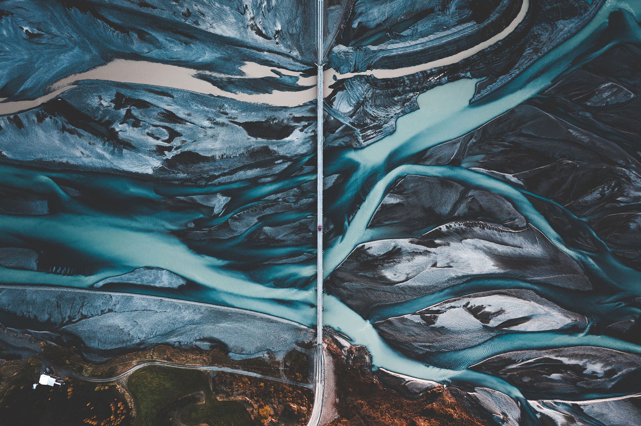 Braided glacial rivers create abstract patterns in Iceland’s landscape.