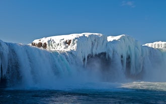 In winter, North Iceland waterfalls are surrounded by ice and snow.