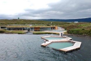 The floating geothermal pools of Vok Baths sit on Lake Urridavatn, surrounded by open landscapes near Egilsstadir.