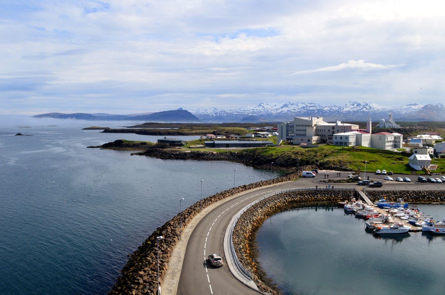 Panoramic view of a car driving along the Stykkisholmur Harbor in West Iceland.