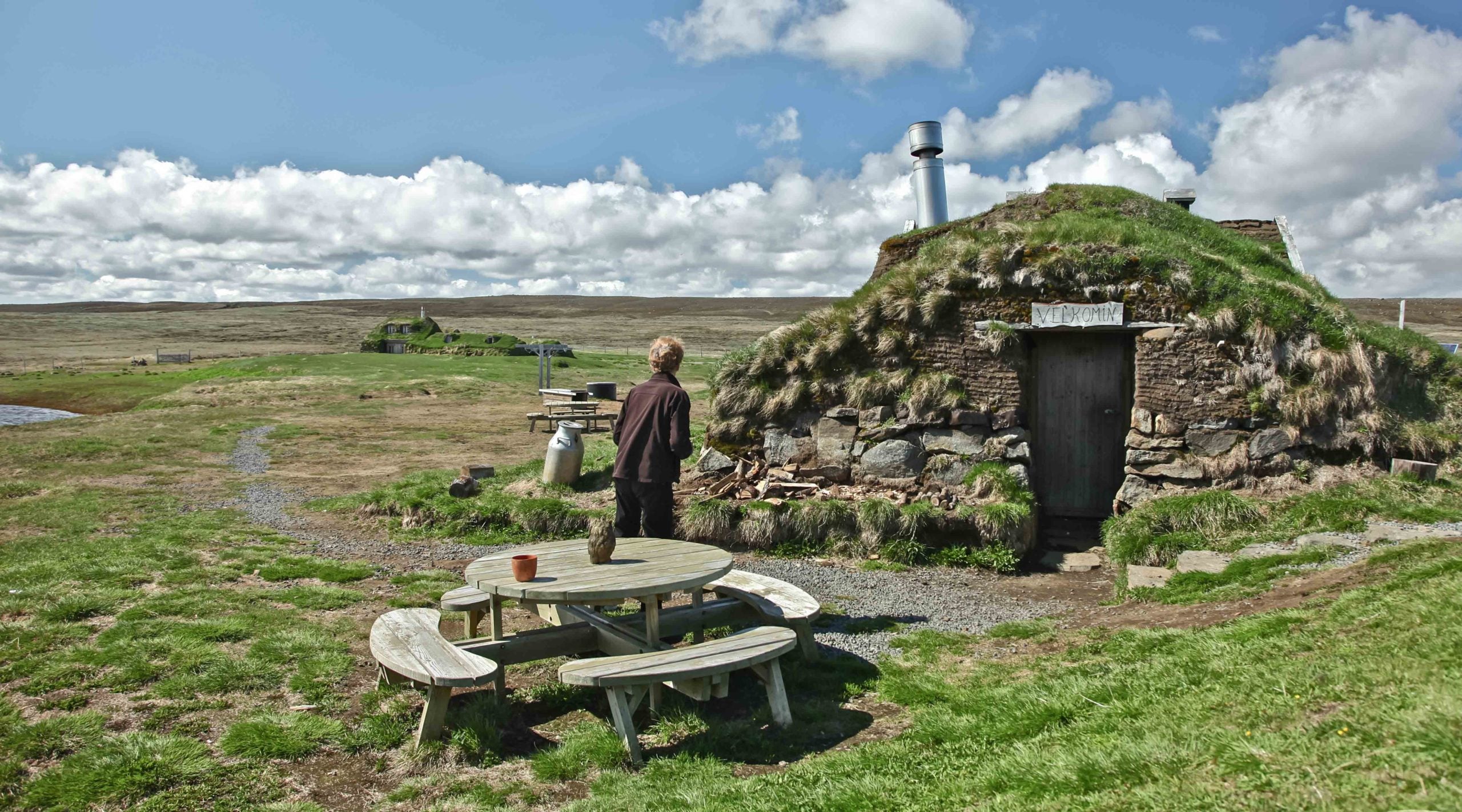 Traditional Icelandic turf house with grass roof at the historic Saenautasel Farm in East Iceland.