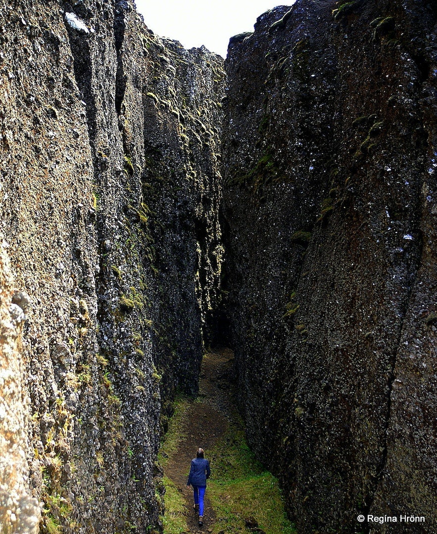 Regina Hronn walking through the Lambafellsgja Fissure on the Reykjanes Peninsula. Regina Hronn walking through the Lambafellsgja Fissure on the Reykjanes Peninsula.