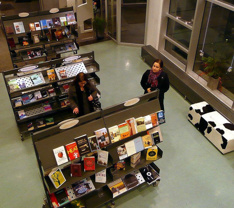 People browsing books at the Reykjavik City Library