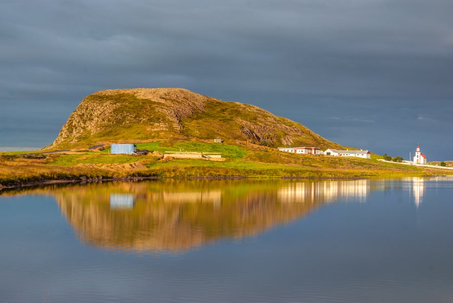 Helgafell hill reflected in a calm lake near Stykkisholmur, Iceland.