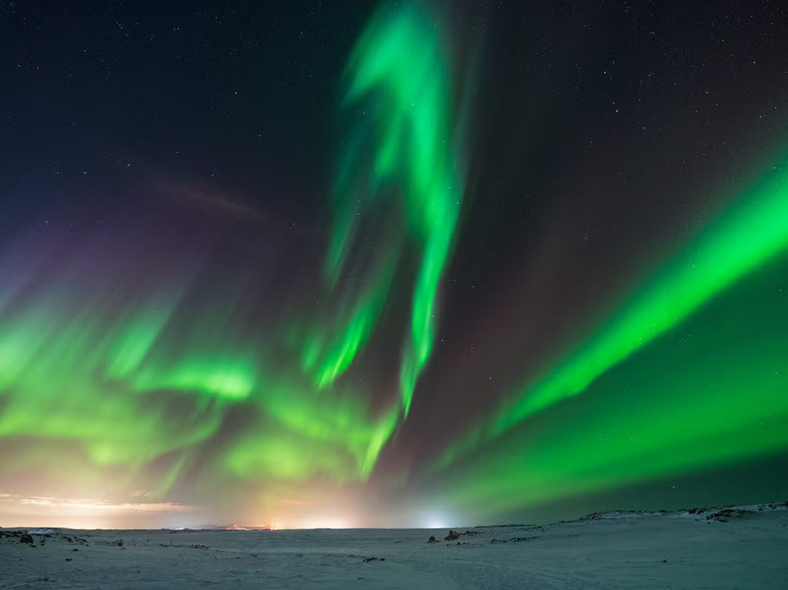Aurora Borealis dancing across the night sky in Iceland.