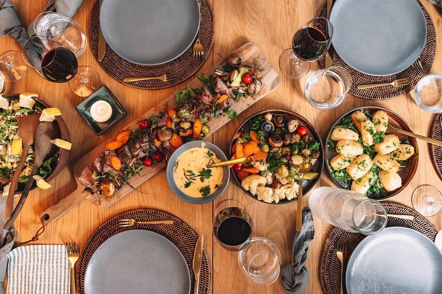 Seasonal dishes at Vegamót Café with roasted meats, vegetables, and fresh salads.