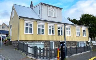 Elegant Reykjavik villa featuring spacious bedrooms, chef’s kitchen, and private garden near city attractions.