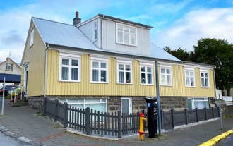 Elegant Reykjavik villa featuring spacious bedrooms, chef’s kitchen, and private garden near city attractions.