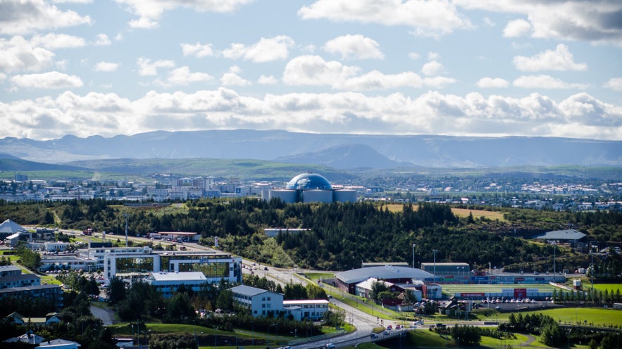 The vibrant Oskjuhlid hill and forest seen from a distance. The vibrant Oskjuhlid hill and forest seen from a distance.