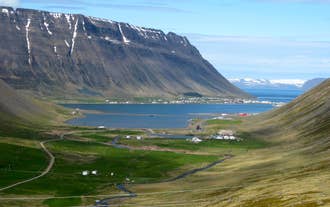 Charming coastal village in Iceland’s Westfjords surrounded by dramatic fjords.