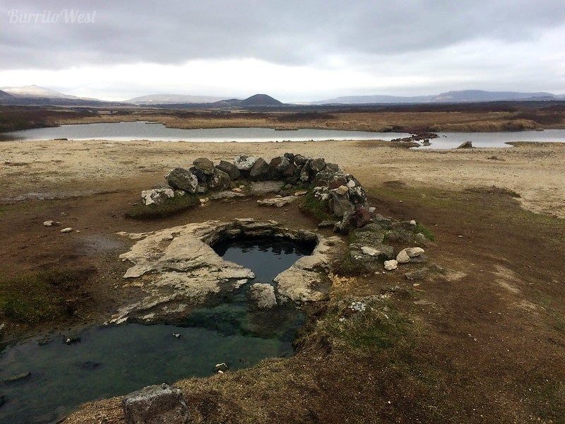 The Landbrotalaug hot spring is hidden behind a small rock wall, making it private and secluded. The Landbrotalaug hot spring is hidden behind a small rock wall, making it private and secluded.