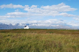 The surrounding landscape of Husavik is home to the Geothermal Goldfish pond. 