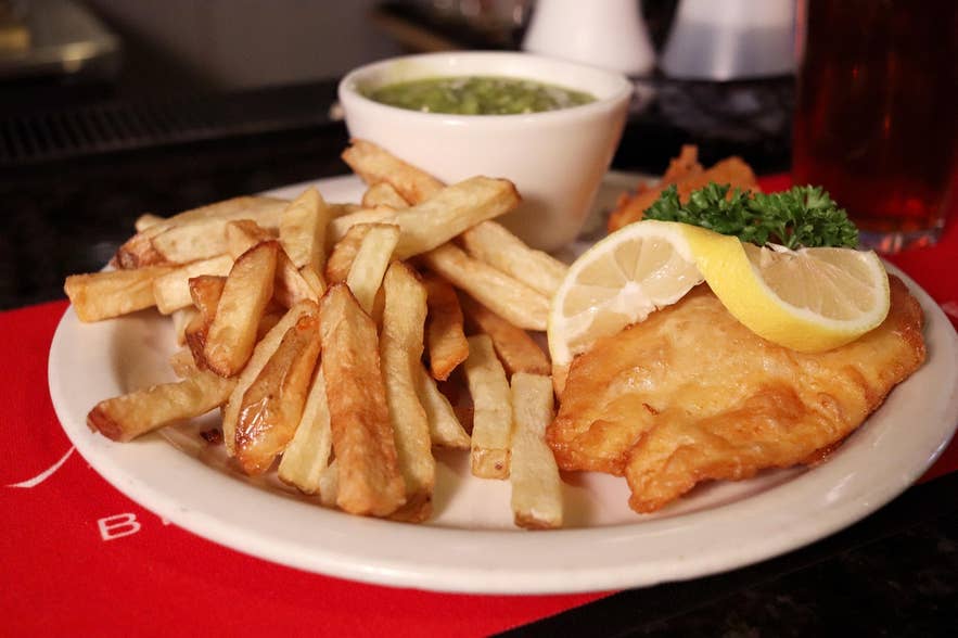 Crispy fish and chips topped with lemon.