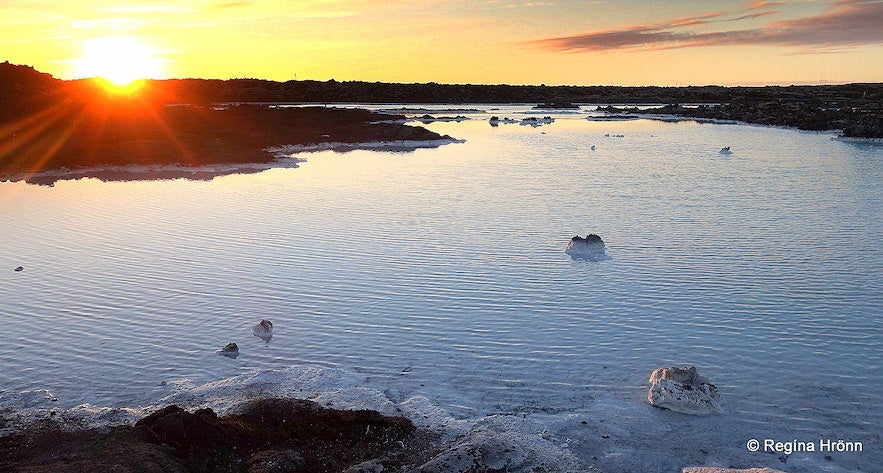 The sun sets over the Blue Lagoon's geothermal waters in Iceland.