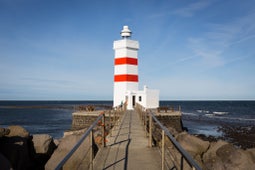 The old Gardskagi lighthouse in Gardur village is one of the most beautiful lighthouses in Iceland.