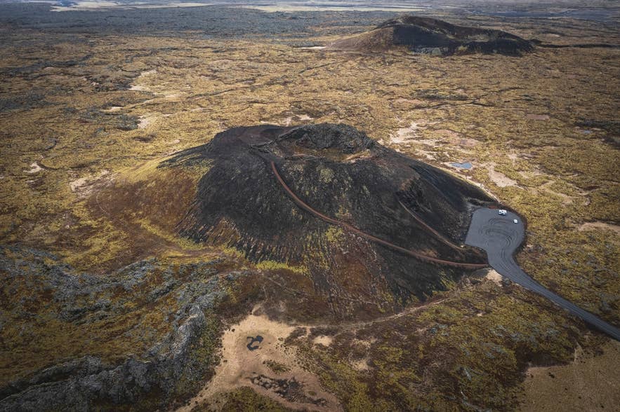 Aerial view of Saxholl Crater in Snaefellsnes Peninsula, Iceland, showing hiking trails and volcanic landscapes around Saxholl.