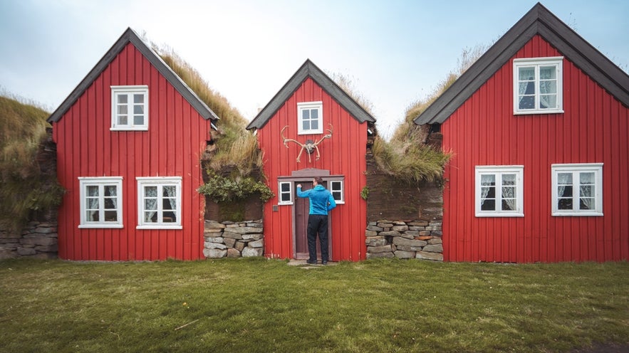 Historic red turf houses in Bustarfell Museum in East Iceland.