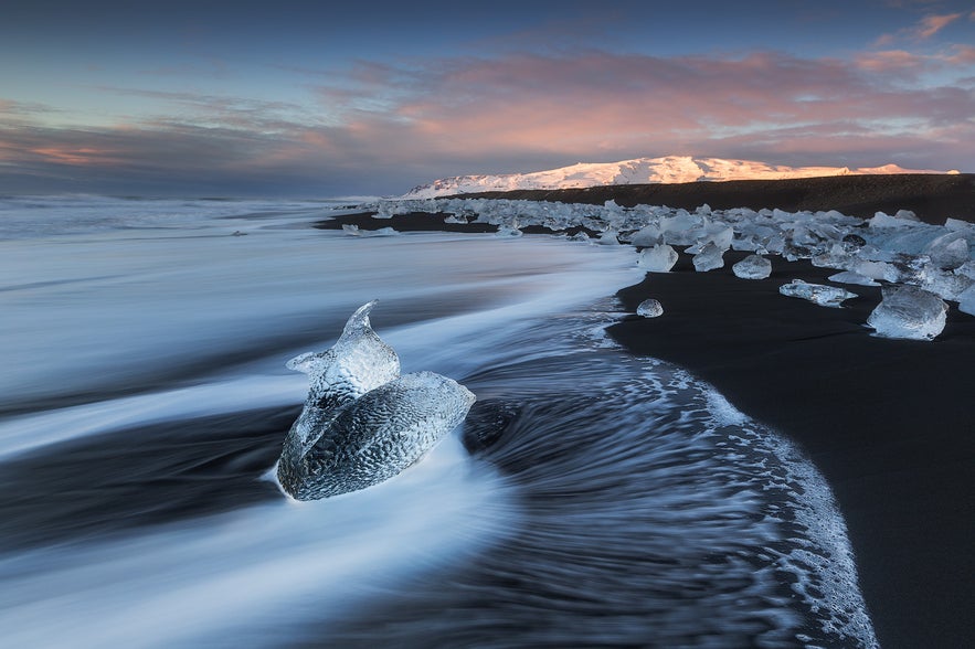 Chunks of glacial ice lie on the black sand of Diamond Beach on Iceland’s South Coast.
