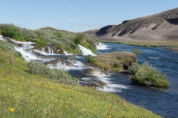 Fossabrekkur waterfalls in South Iceland during summer time.