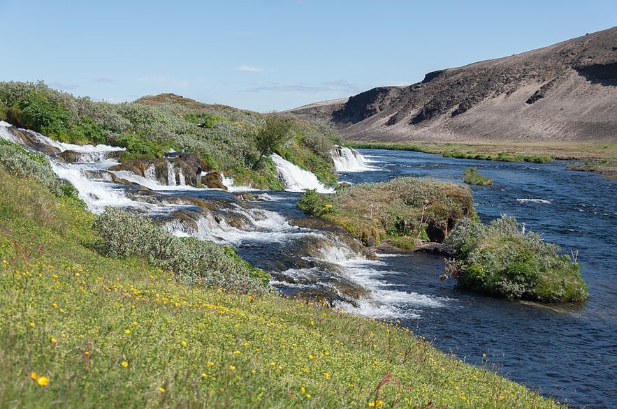 Fossabrekkur waterfalls in South Iceland during summer time. Fossabrekkur waterfalls in South Iceland during summer time.