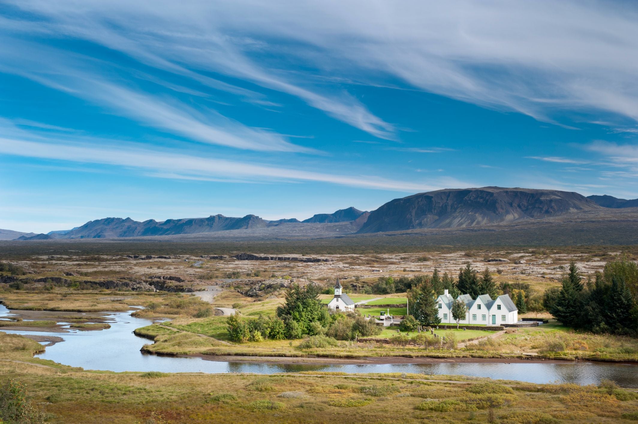The white buildings and surrounding landscapes in the Thingvellir National Park.