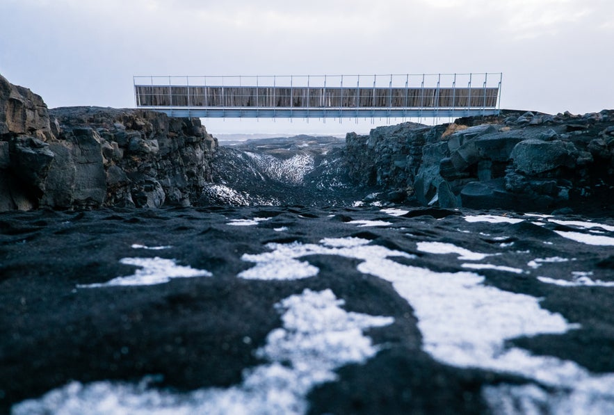 Bridge Between Continents over a snowy lava rift on the Reykjanes Peninsula.