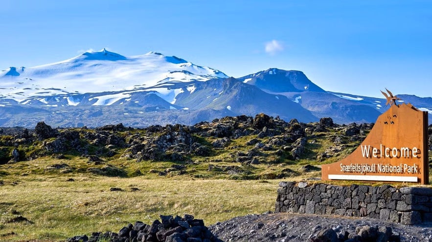Snow-covered Snaefellsjokull glacier volcano rising above rugged terrain on the Snaefellsnes Peninsula.