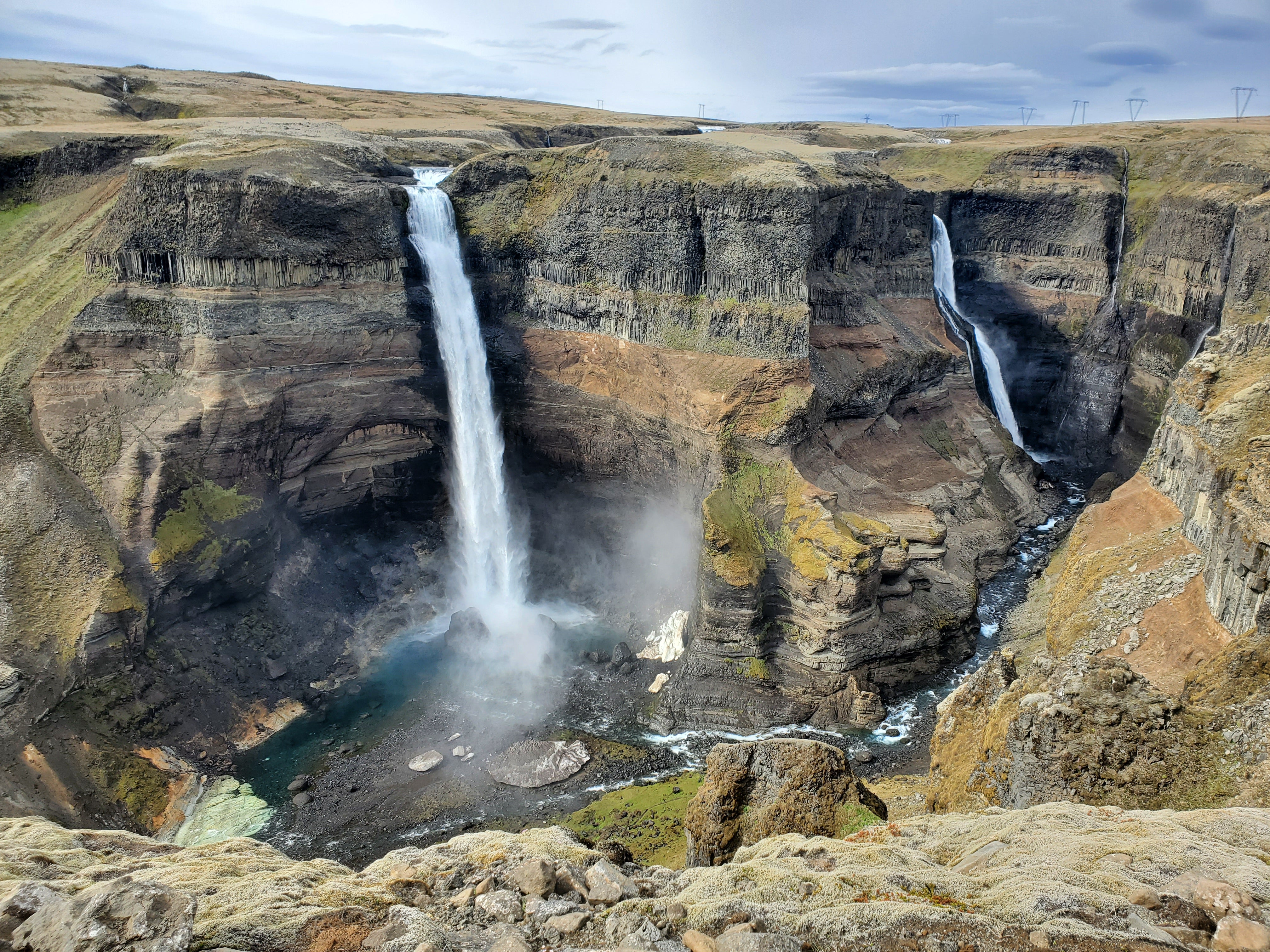 Haifoss and Granni Waterfalls cascading into a deep canyon in South Iceland.