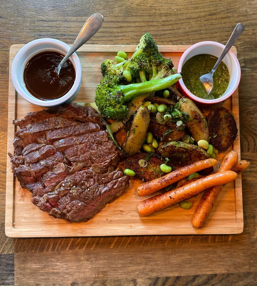 Sirloin steak with roasted sweet potatoes, broccoli, and two delicious sauces at Lilly & Julia’s – Viking BBQ. Sirloin steak with roasted sweet potatoes, broccoli, and two delicious sauces at Lilly & Julia’s – Viking BBQ.