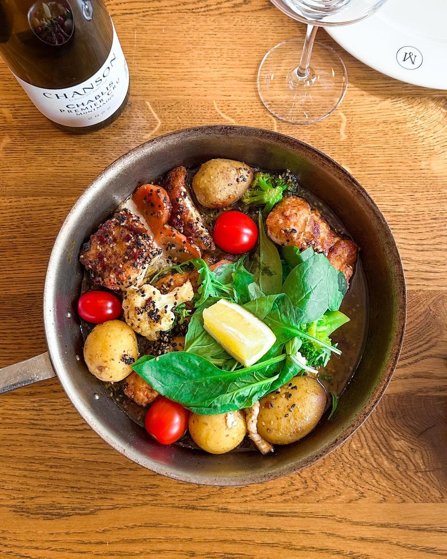 Delicious pan-fried chicken with potatoes, tomatoes, and fresh greens at Mar Seafood in Selfoss, Iceland. Delicious pan-fried chicken with potatoes, tomatoes, and fresh greens at Mar Seafood in Selfoss, Iceland.