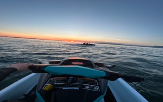 View from a jet ski riding toward the sunset on Faxafloi Bay in Reykjavik.