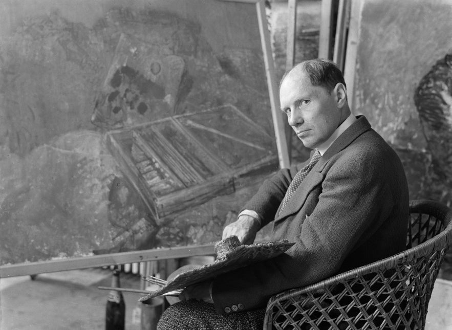 A portrait of Johannes Sveinsson Kjarval while painting.