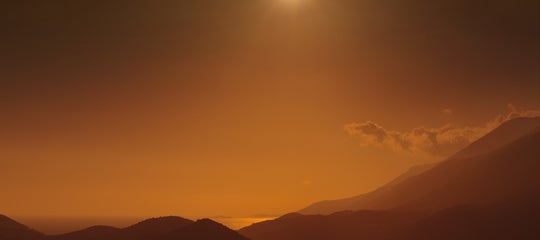 solar eclipse mountains not-iceland shutterstock_2392516359.jpg