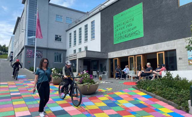 The entrance of the Akureyri Art Museum is characterized by a charming seating area