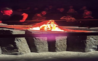 A live host shows the audience how real lava reacts and moves.