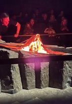 A live host shows the audience how real lava reacts and moves.