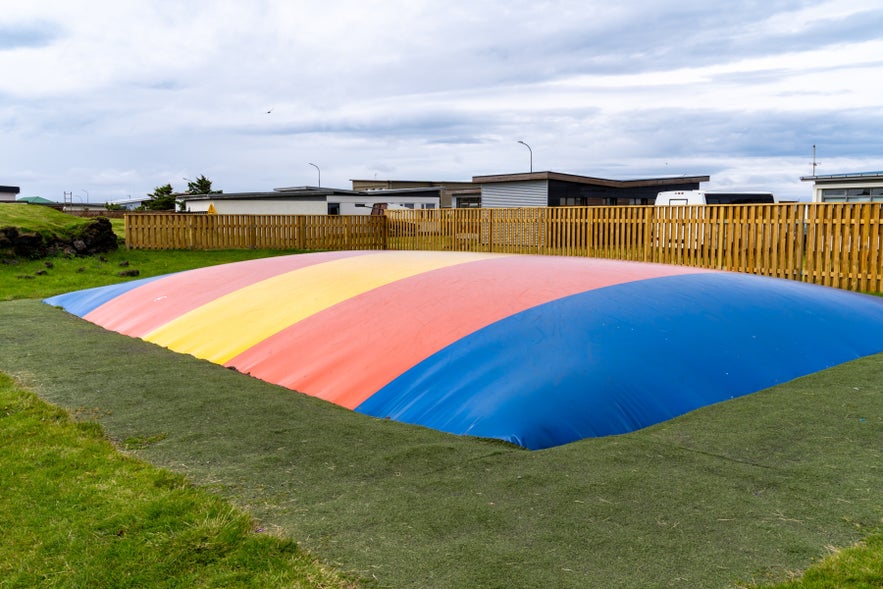 Colorful jumping balloon trampoline at a playground park in Iceland
