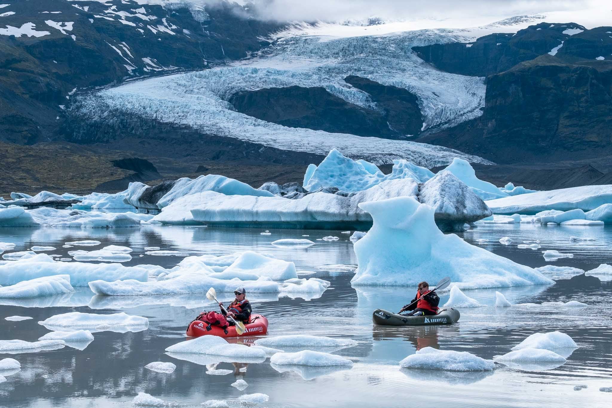 Travelers paddling quietly through the icy landscape of Fjallsarlon Glacier Lagoon.