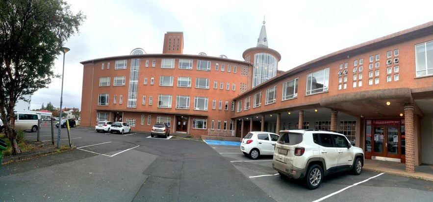 Entrance to Baron's Hostel with parked cars in Reykjavik, Iceland.