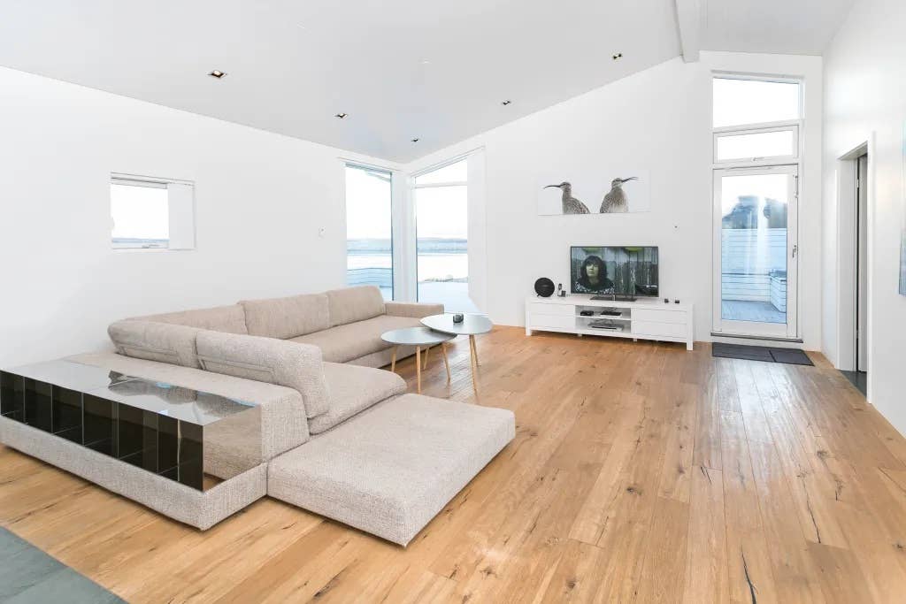 Inside, the Luxury Villa with River View has a large living room with a flat-screen TV.