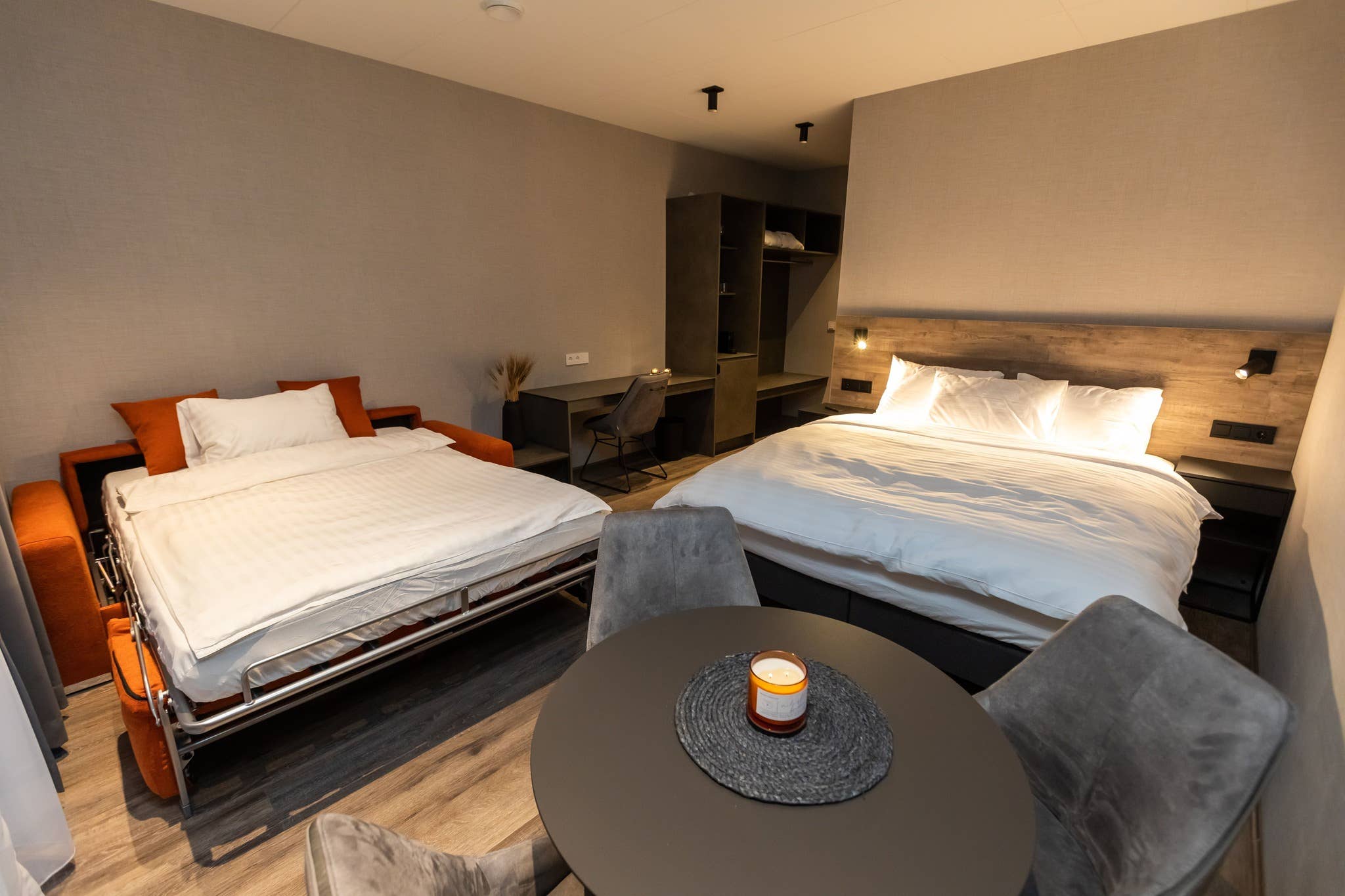 A Hotel Halond room complete with a double bed and a sofa bed.